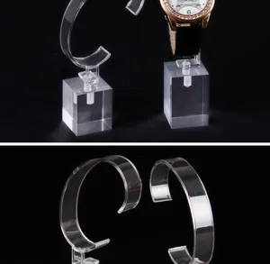 Detail shot of transparent acrylic watch display stands with professional C-ring holders