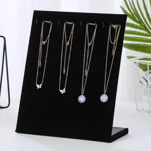 Professional black velvet L-shaped jewelry display stand for organizing necklaces.