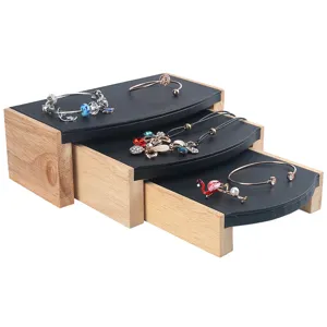 Elegant three-piece solid wood and black leather tiered jewelry display stand set for shops