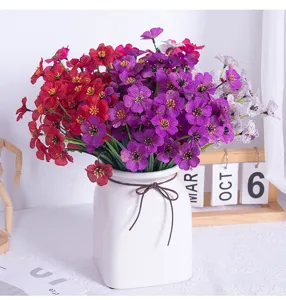 Artificial violet flower bouquet with ceramic vase, perfect for home and wedding decor.