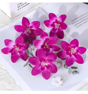 Künstliche violette Orchideenköpfe für Hochzeitskorsagen, Armblumen und Geschenkboxen.