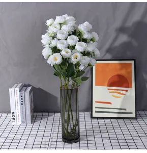 Artificial peony bouquet in glass vase, elegant white flower arrangement for home decor wedding details.