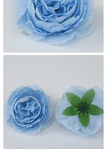 Details of artificial blue ranunculus flower head showing front and back texture.