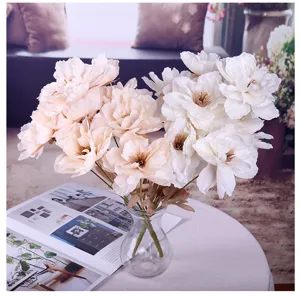 Artificial peony flower detail shot, showing delicate silk petals and realistic stems.
