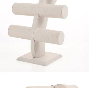 Detailed close-up view of a 2-tier linen fabric jewelry display stand for bracelets