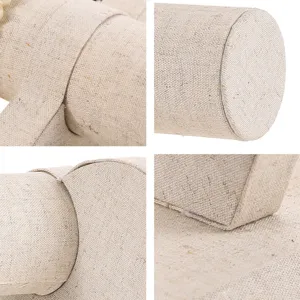 Close-up details showing the texture of a beige linen jewelry display stand for bracelets
