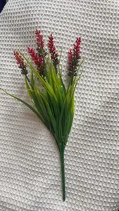 Detailed view of artificial red lavender flower bunch, plastic photo prop for home decor.