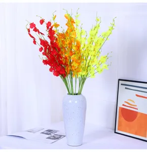 Artificial dancing orchid flower detail, colorful bouquet arrangement for home decor.