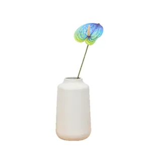 Artificial Anthurium flower single branch fake plant with white vase for home decor setup.