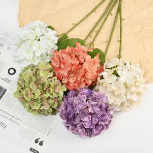 Detailed view of colorful artificial hydrangea flowers with long stems for wedding decoration.