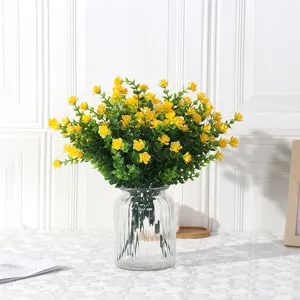 Artificial yellow eucalyptus flowers in glass vase for home and wedding decor main image