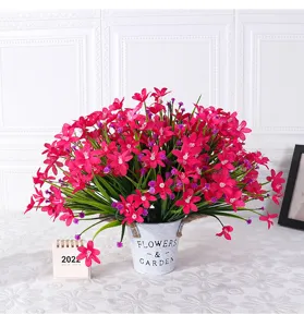 Detailed view of artificial pink flowers in metal pot, perfect for home decor and tabletop display.
