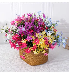 Artificial orchid flower bouquet in woven basket, colorful spring grass plant home decor.