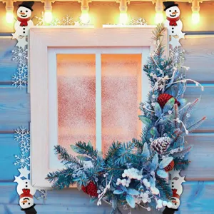 Close-up of Christmas door corner decoration featuring cute snowmen and festive snowflake details.