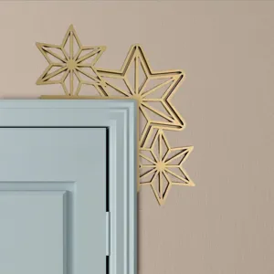 Gold star door corner decoration, metal geometric frame accent, elegant home holiday decor.