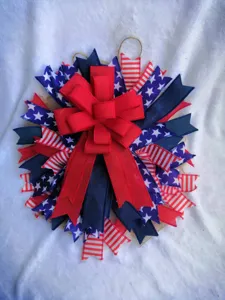 Patriotic American Independence Day wreath door hanging red white and blue star ribbon decor.