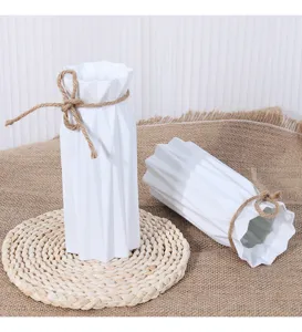 Modern minimalist white plastic flower vase with twine decoration, shatterproof home decor.