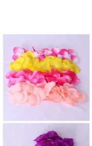 Artificial rose petals detail showing colorful fabric flower heads for wedding party decor.