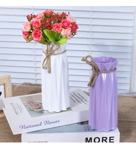 Modern minimalist plastic flower vase for home decor and floral arrangements. Durable design.