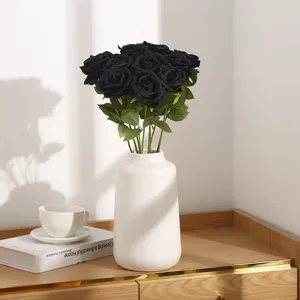Artificial black rose bouquet in white ceramic vase for home decor wedding party.
