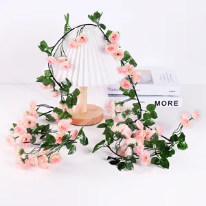 Artificial pink rose flower vine garland for home wedding balcony wall hanging decor.