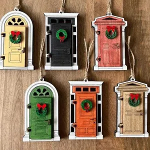 Miniature wooden fairy doors with Christmas wreaths, vintage hanging ornaments for home decor.