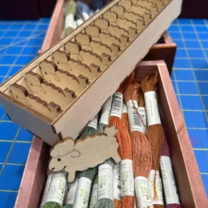 Wooden sheep shaped thread bobbins set with storage box and colorful embroidery floss for sewing crafts