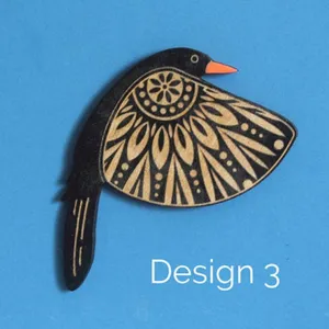 Detailed close-up of wooden flying bird wall hanging with mandala carved wing design.