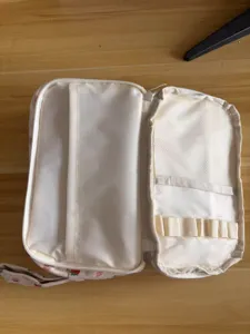 Corduroy pencil case dual layer makeup pouch open view showing internal mesh pockets and slots