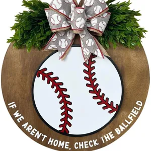 Baseball wooden door sign with greenery and bow for front porch home decor hanging item.
