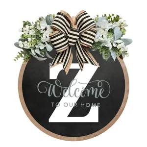 Targa rotonda in legno per porta d'ingresso con lettera Z, fiocco nero bianco e verde.