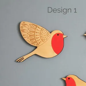 Detailed close-up of wooden robin bird wall hanging, laser-cut craft with red painted chest.