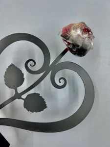 Metal heart shaped stand rose ornament detail shot, showing the delicate leaf and flower structure.