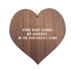 Wooden heart plaque hanging sign with natural wood grain for home decor and holiday gift.