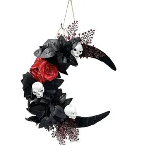 Halloween gothic crescent moon wreath with black leaves, red roses and skull decor.