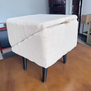 Detail shot of the beige split pet stool and climbing ramp, showing soft fabric and legs.