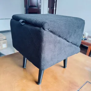 Convertible 2-in-1 pet steps and storage stool for dogs and cats, black fabric design.