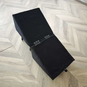 Detailed view of the pet stairs hinge mechanism, showing black fabric and sturdy metal hardware.