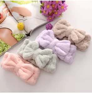 Soft coral fleece bow headband for daily makeup washing face, comfortable wide hair band.