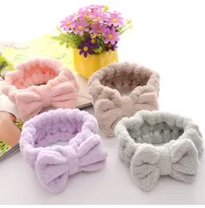 Detailed close-up of soft coral velvet bow headbands in four lovely colors for skincare.
