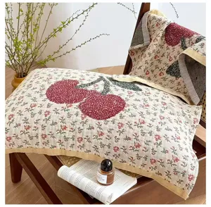 Detailed view of 4-layer gauze pillowcase with cute cherry embroidery, breathable cotton.