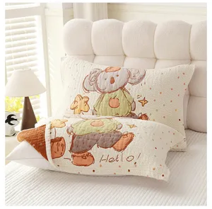 Detailed view of soft cotton gauze cartoon koala print pillow towel in cozy bedroom setup.