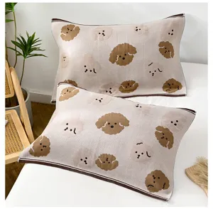 Cozy cotton knitted pillowcase set featuring cute dog pattern in a warm bedroom scene.