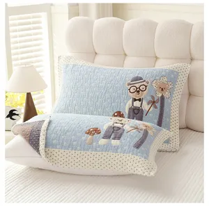 Detailed view of soft cotton gauze pillow towel featuring cute cartoon bear embroidery design.