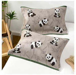 Cotton gauze pillow cover detail showcasing cute panda and bamboo pattern with green border.