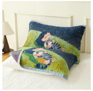 Close-up detail of soft cotton four-layer gauze pillow towel with cute cartoon cat print.