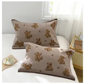 Cozy knitted pillowcases featuring cute bear and star patterns, breathable home bedding decor.