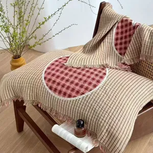 Four-layer gauze striped pillow towel with red plaid circle and fringe trim for home bedroom.