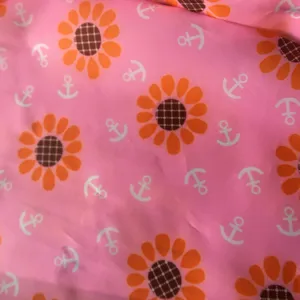 Waterproof toy storage bag fabric detail, cute sunflower and anchor print design.