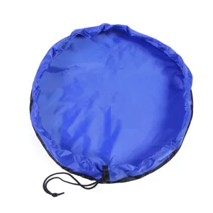 Large blue round toy storage bag and waterproof outdoor beach mat with black drawstring.